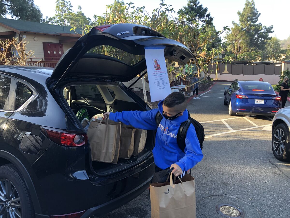 Students at The Rhoades School recently took part in a food and gift card drive to benefit the nonprofit Casa de Amistad.