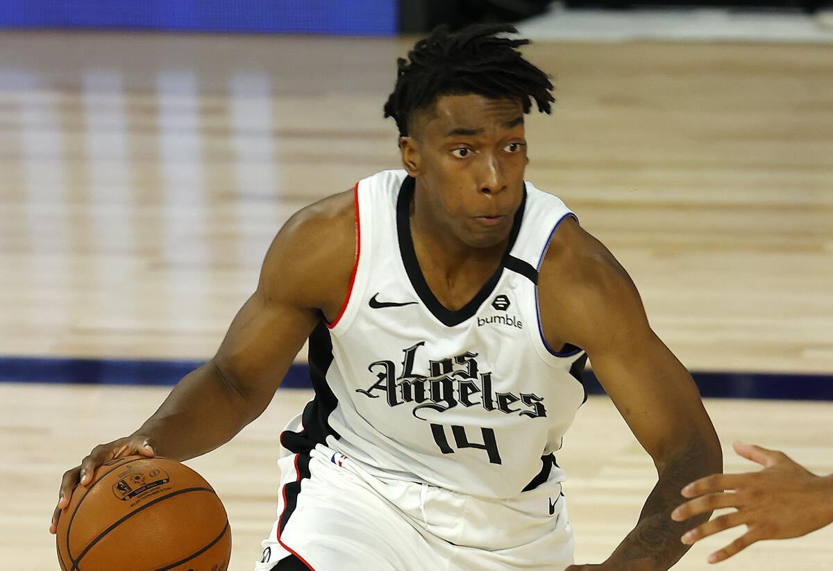 The Clippers' Terance Mann drives against the Thunder on Aug. 14, 2020.