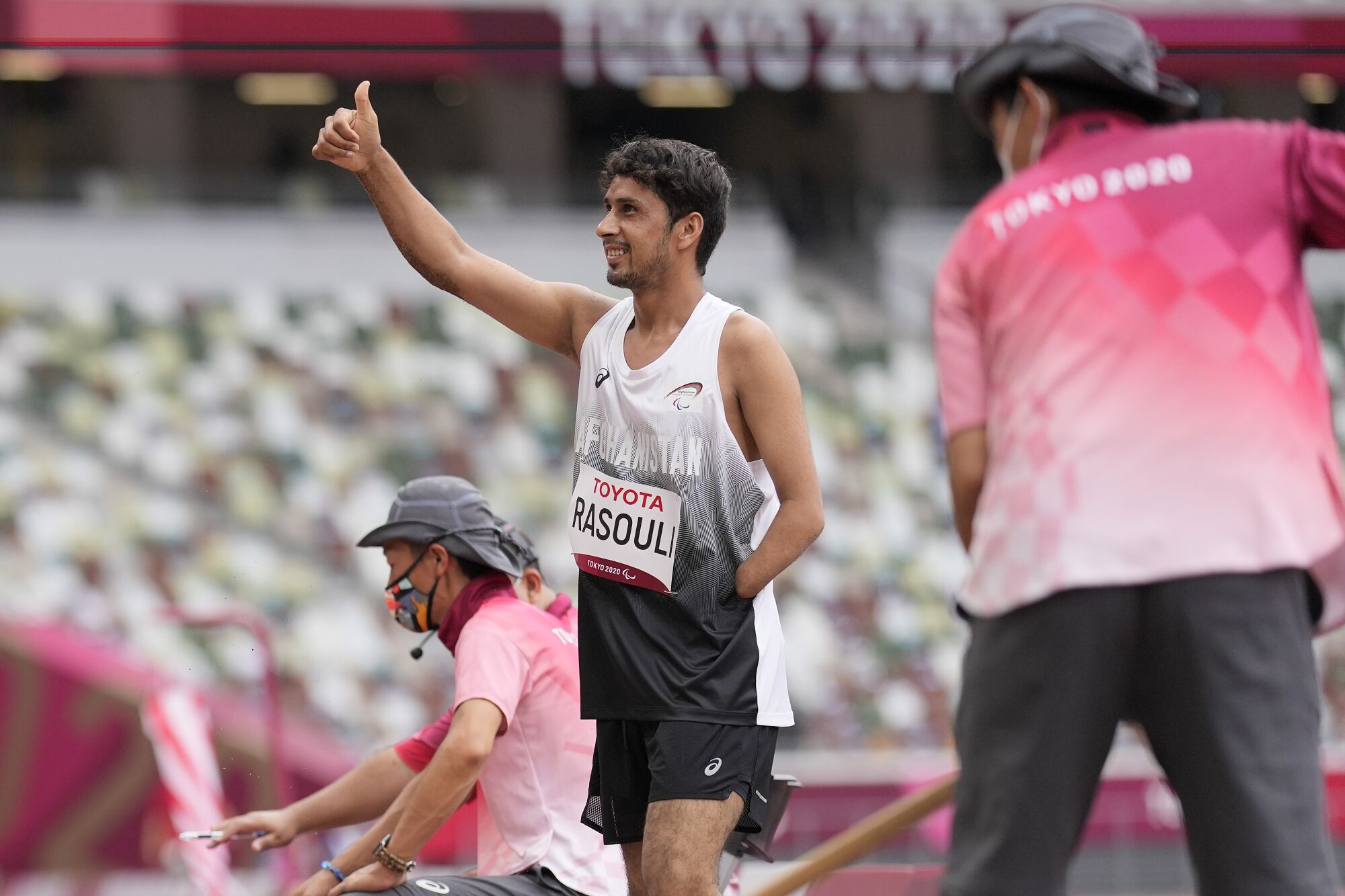 Afghanistan's Hossain Rasouli gives a thumbs up after his first attempt in the men's long jump.