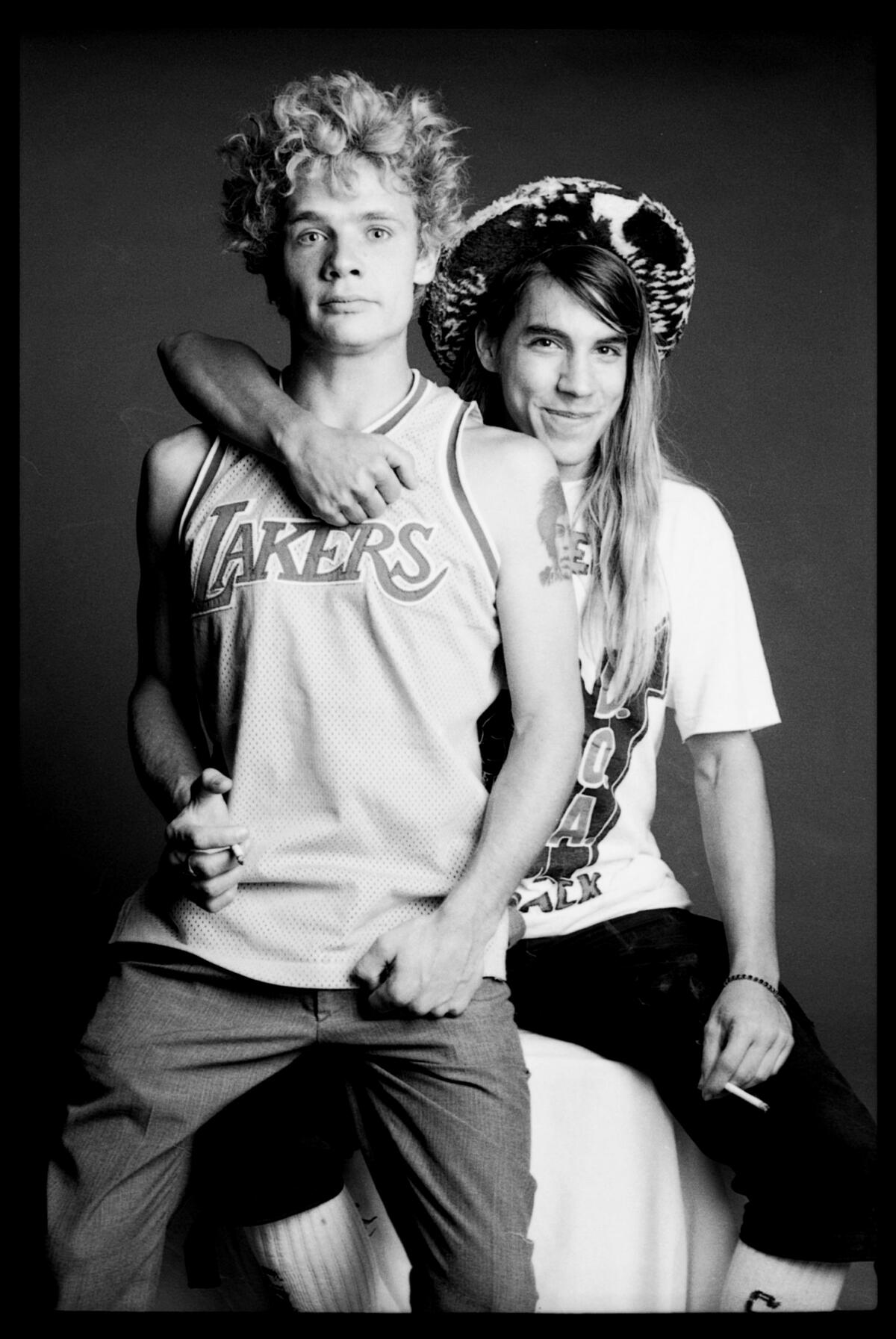 Flea and Anthony Kiedis, young and long-haired