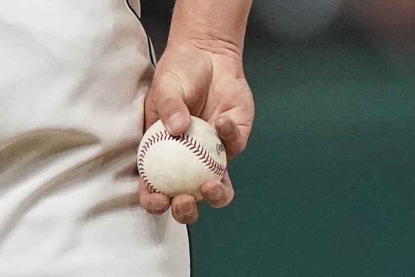 Cleveland Indians relief pitcher James Karinchak holds the ball between pitches during the eighth inning of the team's baseball game against the Baltimore Orioles, Tuesday, June 15, 2021, in Cleveland. (AP Photo/Tony Dejak)