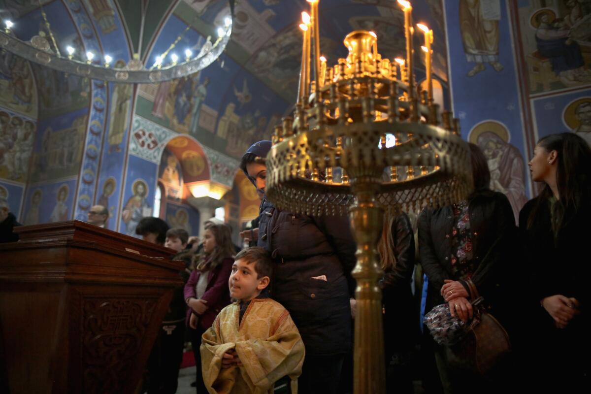 An altar boy takes part in a service as Serbian Orthodox Christians celebrate the Nativity of Christ liturgy Jan. 7 at Lazarica church in Birmingham, England, a city that a Fox News correspondent said is a "no-go zone" for non-Muslims.