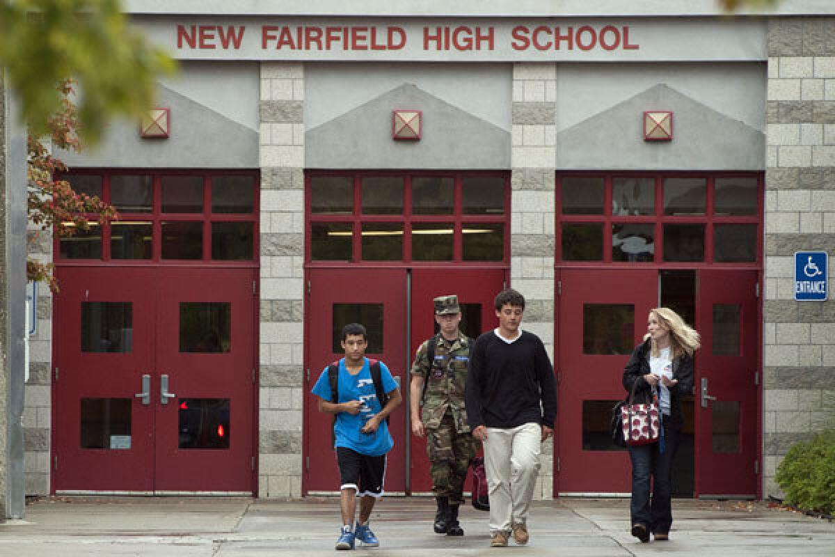 Students leave New Fairfield High School in Connecticut. Tyler Giuliano, a student involved in Civil Air Patrol at the school, was killed by his father, Jeffrey Giuliano, during what appeared to be an attempted burglary.