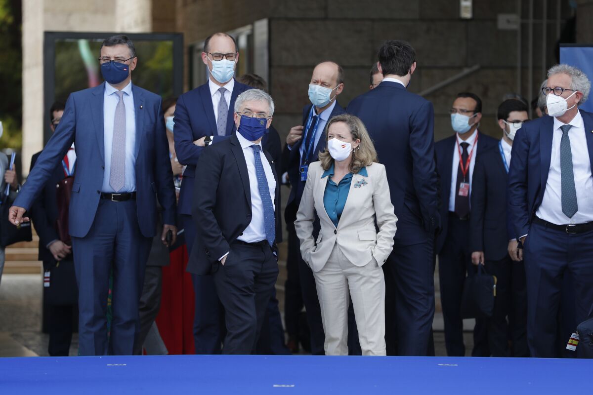 FILE - Spain's Economy Minister Nadia Calvino, center right, speaks with Italy's Finance Minister Daniele Franco, center left, prior to a group photo of EU finance ministers and central bankers during a meeting in Lisbon, on May 21, 2021. Calvino is making a stand for gender equality, saying she won't take part in any more events or official photographs where she is the only woman present. The Spanish government has made women's rights a central plank of its policies and the Cabinet has 12 women and 10 men. (AP Photo/Armando Franca, File)