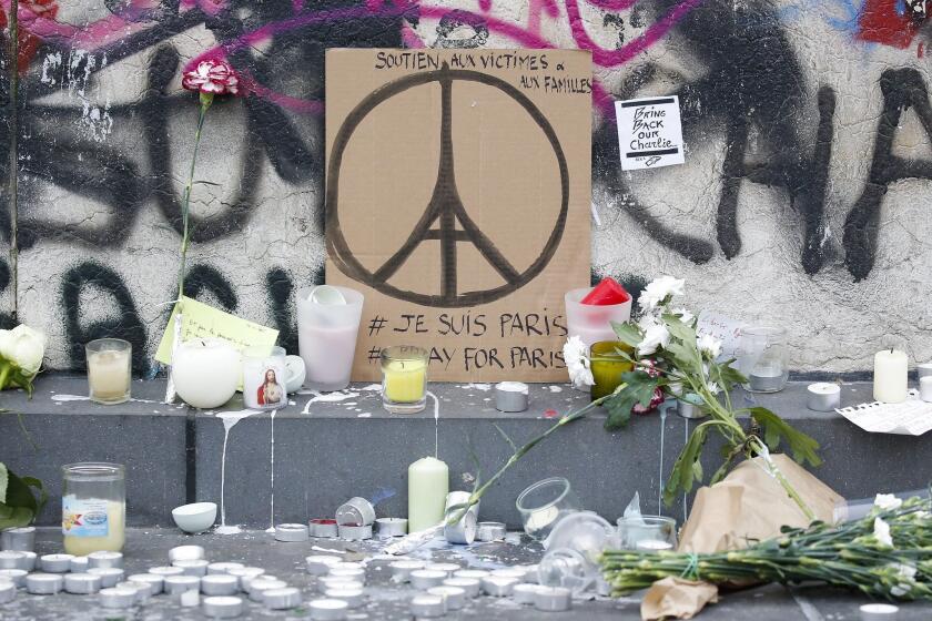 Memorials in Paris pay tribute to those killed in Friday's terror attacks.