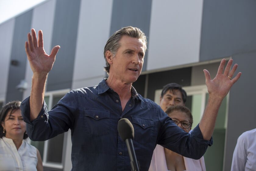 Los Angeles, CA - August 24 Gov. Gavin Newsom speaks a Homekey site to announce the latest round of awards for homeless housing projects across the state on Wednesday, Aug. 24, 2022 in Los Angeles, CA. (Brian van der Brug / Los Angeles Times)