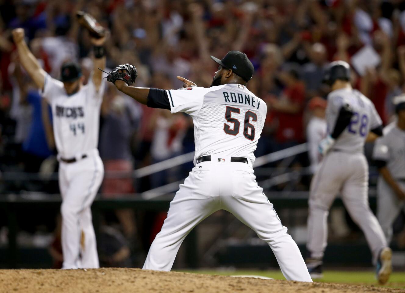 Arizona Diamondbacks relief pitcher Fernando Rodney (56) celebrates after the National League wild-card playoff baseball game against the Colorado Rockies, Wednesday, Oct. 4, 2017, in Phoenix. The Diamondbacks won 11-8 to advance to an NLDS against the Los Angeles Dodgers. (AP Photo/Ross D. Franklin)