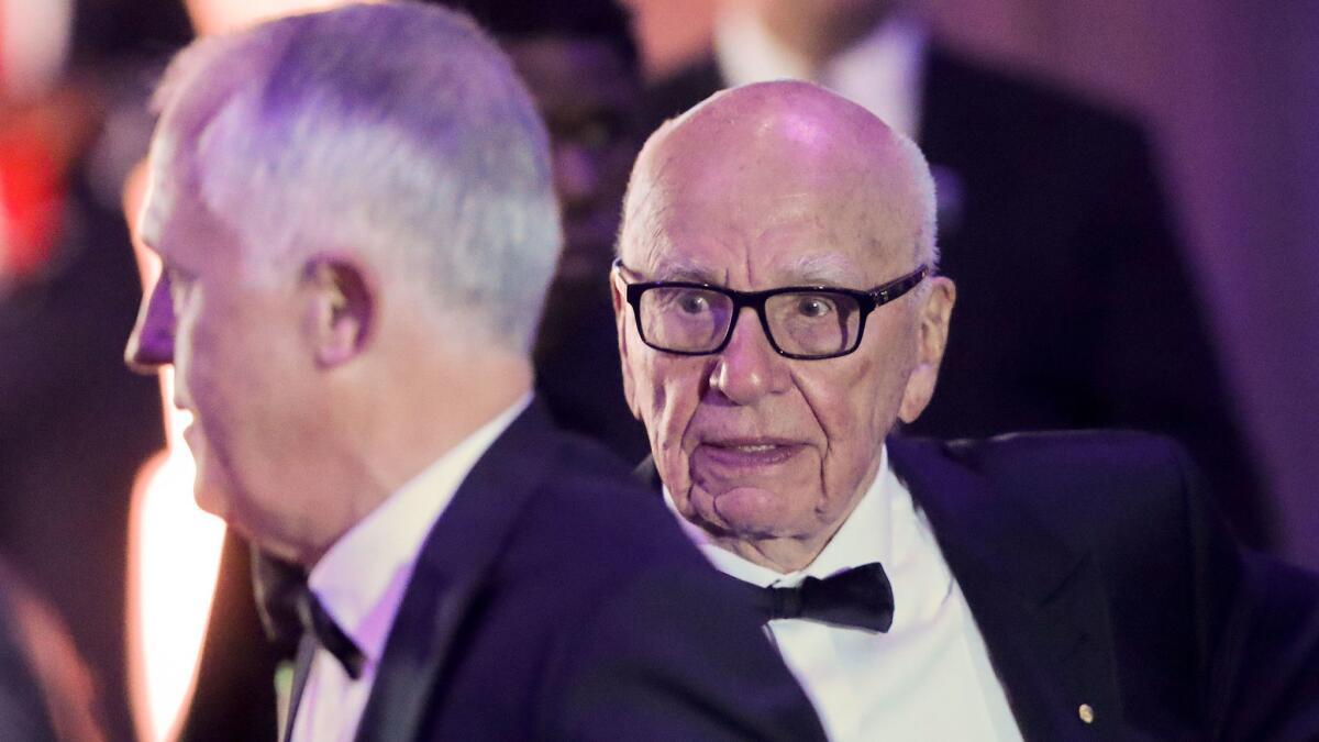 Fox's Rupert Murdoch, right, with Australian Prime Minister Malcolm Turnbull aboard the aircraft carrier Intrepid last week.