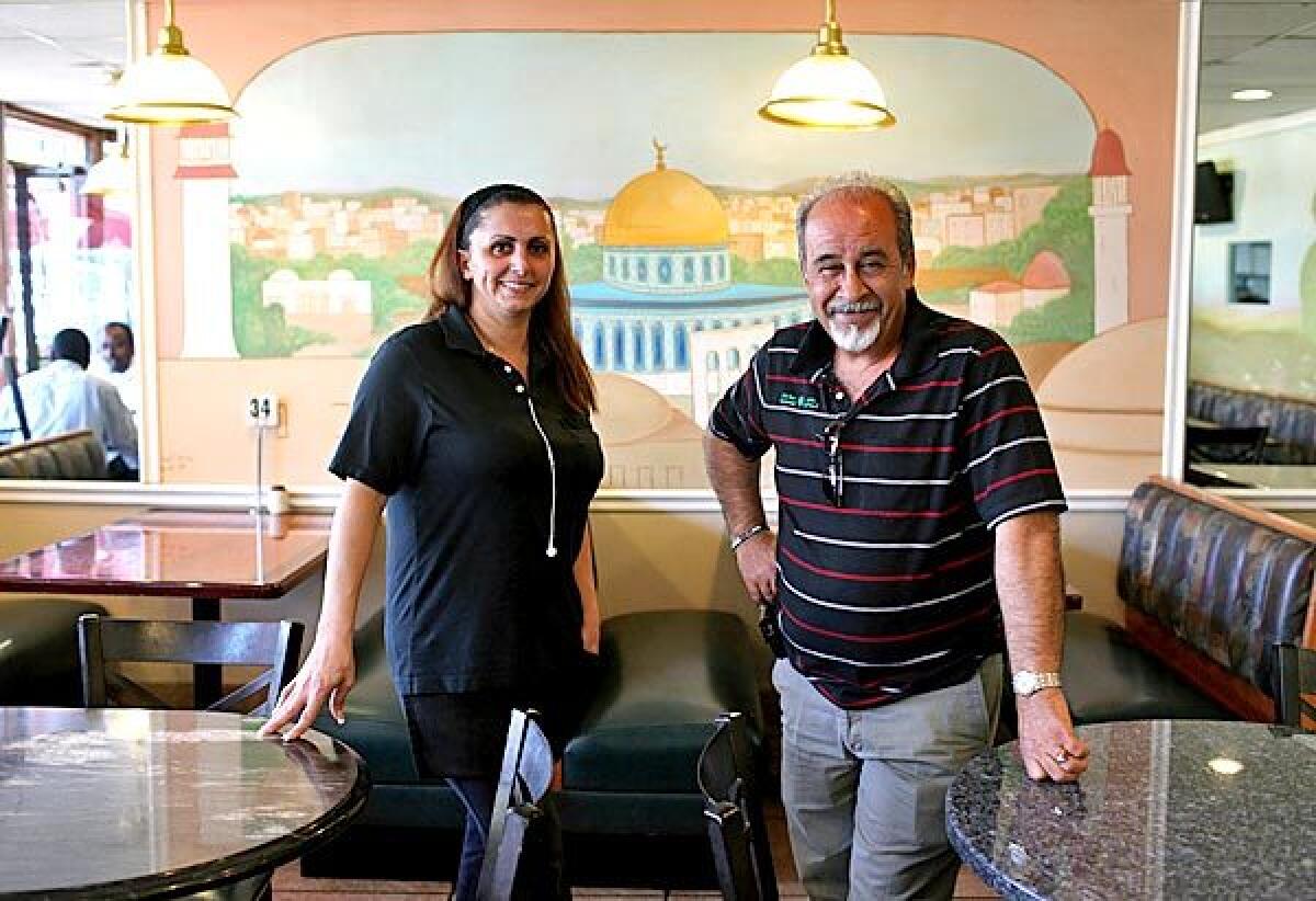 Suzan Hassan is floor manager and Abu Ahmad owner of the 5-year-old Olive Tree Restaurant in Anaheim, which alongside familiar Middle Eastern dishes also serves regional recipes of Jordan, Syria and elsewhere.