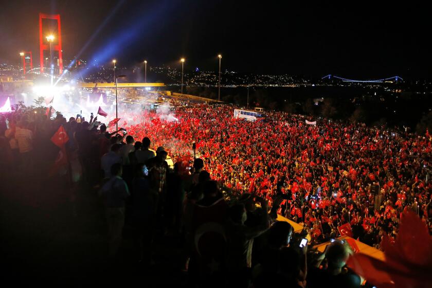 Pro-government supporters flood the road leading to Istanbul's iconic Bosporus Bridge on Thursday, July 21. Turkish lawmakers approved a three-month state of emergency, endorsing new powers for President Erdogan that would allow him to expand a crackdown against his opponents.