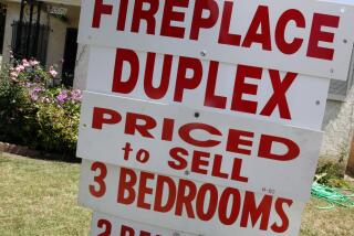 In this June 13, 2011 photo, a duplex is posted 'for sale' in Los Angeles. Fewer people purchased previously occupied homes in May, bringing sales down to their lowest level of the year. (AP Photo/Reed Saxon)