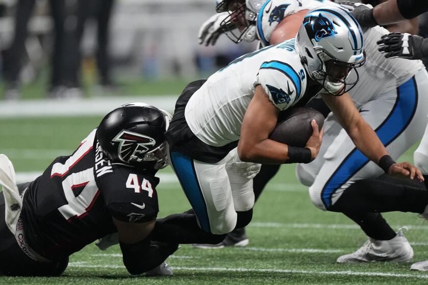 Atlanta Falcons linebacker Troy Andersen (44) sacks Carolina Panthers quarterback Bryce Young (9) during the second half of an NFL football game, Sunday, Sept. 10, 2023, in Atlanta. (AP Photo/John Bazemore)