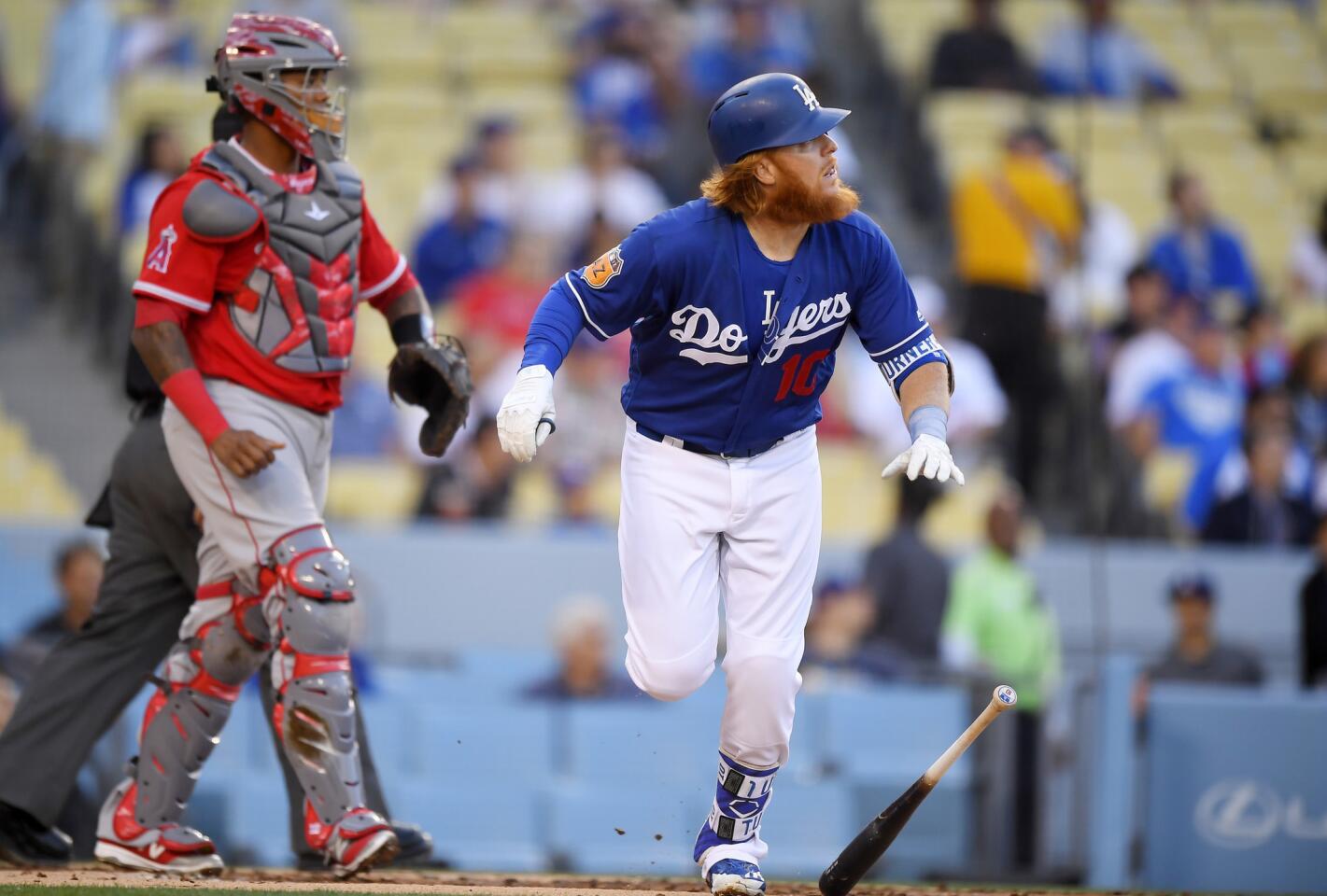 Dodgers third baseman Justin Turner watches his two-run home run against the Angels during the first inning Saturday. The Angels would rally for a 4-4 tie in the final game of the Freeway Series.