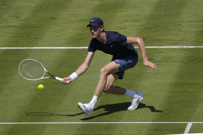Jannik Sinner of Italy plays a return to Jack Draper of Britain during their singles tennis match at the Queens Club tournament in London, Monday, June 14, 2021. (AP Photo/Kirsty Wigglesworth)