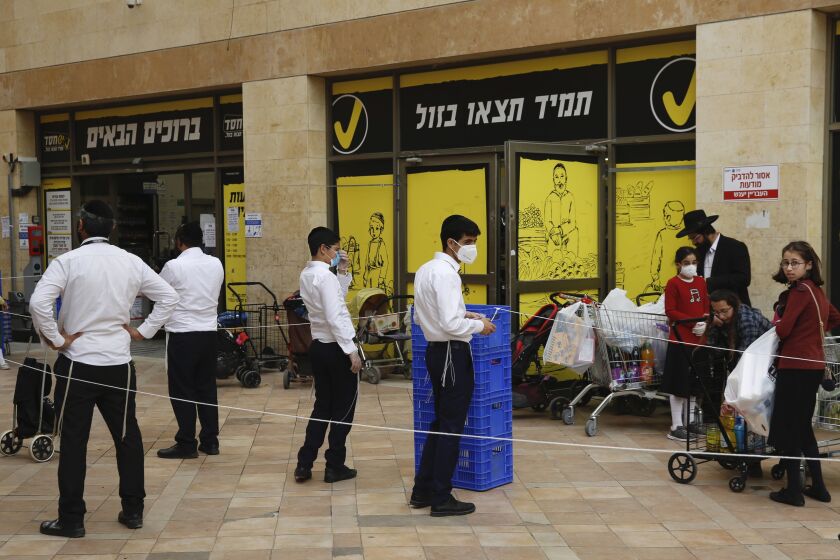 ISRAEL: Ultra-Orthodox Jews wait to enter a supermarket while keeping a safe social distance as part of the government's measures to stop the spread of the coronavirus in the Orthodox city of Bnei Brak, a Tel Aviv suburb, Israel.