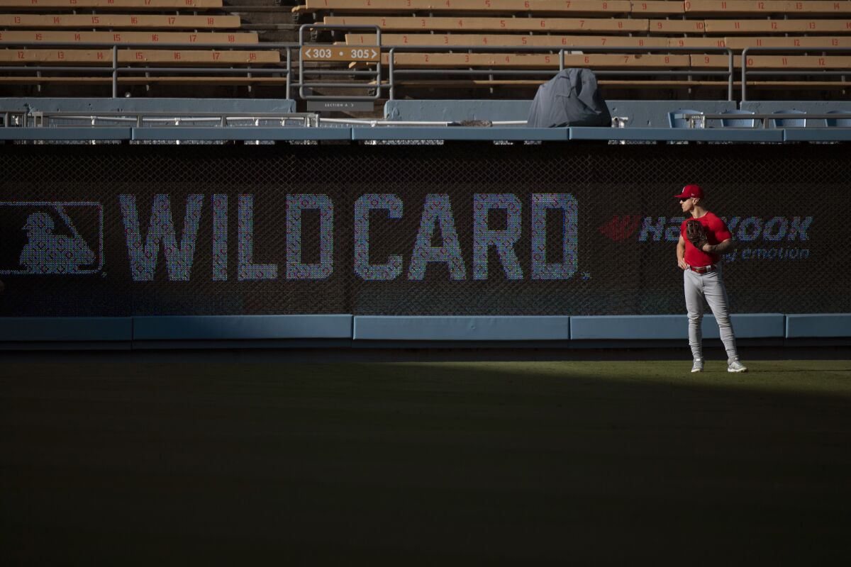 St. Louis Cardinals left fielder Tyler O'Neill looks on during a baseball workout in Los Angeles, Tuesday, Oct. 5, 2021. The Cardinals will play the Los Angeles Dodgers in a wild card playoff game on Wednesday. (AP Photo/Kyusung Gong)