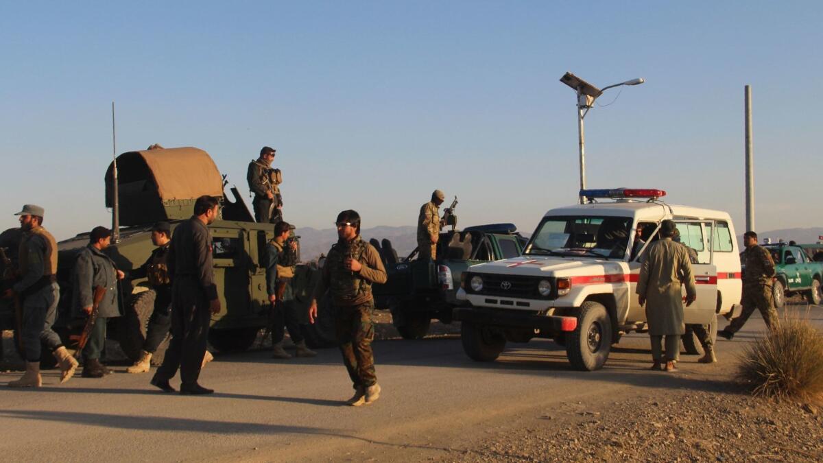 Afghan security force arrive near the site of an explosion that killed 27 on a base in Khost province on Friday.