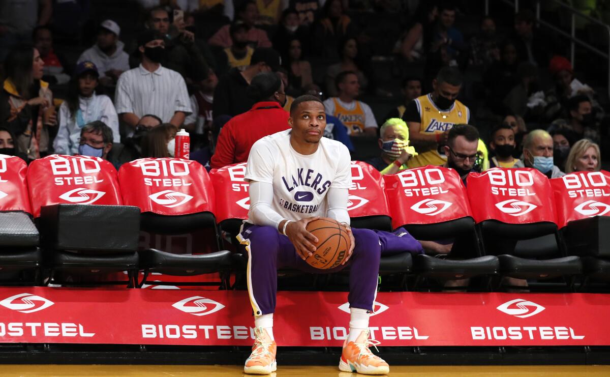 Lakers guard Russell Westbrook sits alone on the bench before taking on the Houston Rockets at Staples Center.