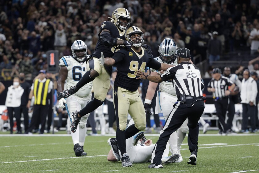 New Orleans Saints defensive end Cameron Jordan (94) celebrates his sack of Carolina Panthers quarterback Sam Darnold in the second half of an NFL football game in New Orleans, Sunday, Jan. 2, 2022. The Saints won 18-10. (AP Photo/Derick Hingle)