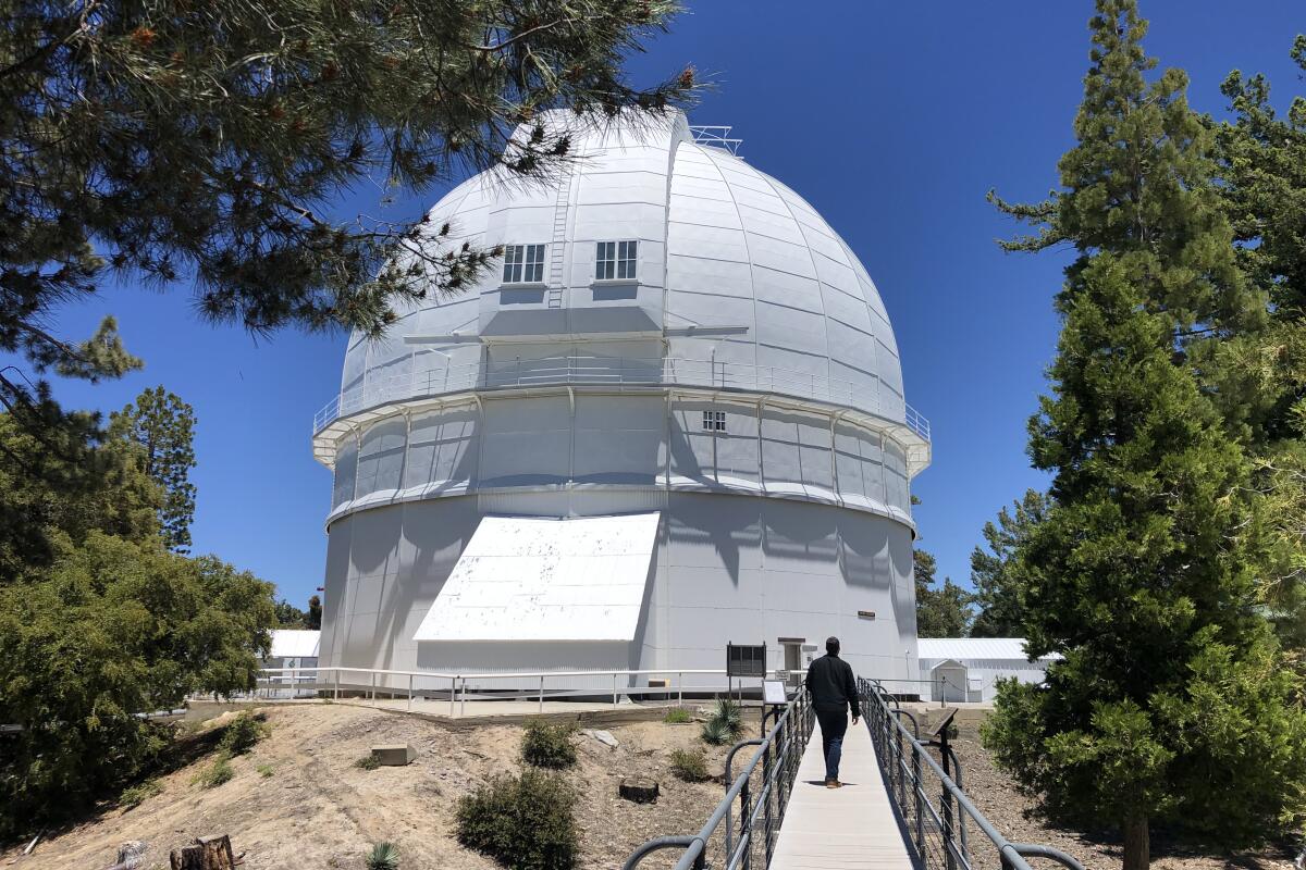 A man walks down an accessible path at Mt. Wilson Observatory in Angeles National Forest in June.