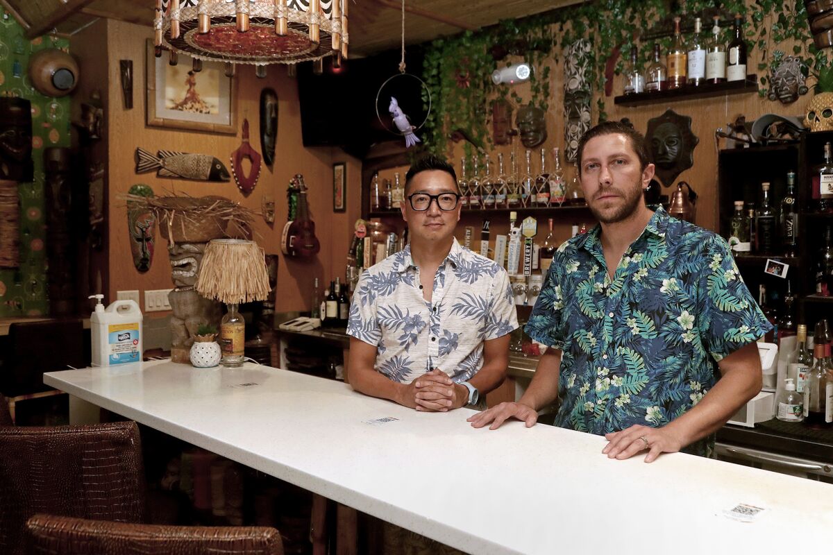 Co-owners Leonard Chan, center, and Dominic Iapello at Stowaway, located in the Union Market, on Aug. 11. 