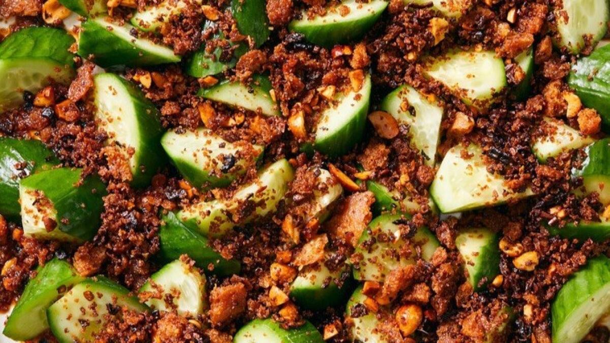 Fried breadcrumbs, spicy with chiles and crunchy with toasted peanuts, provide the perfect balance to cold, crisp Persian cucumbers.