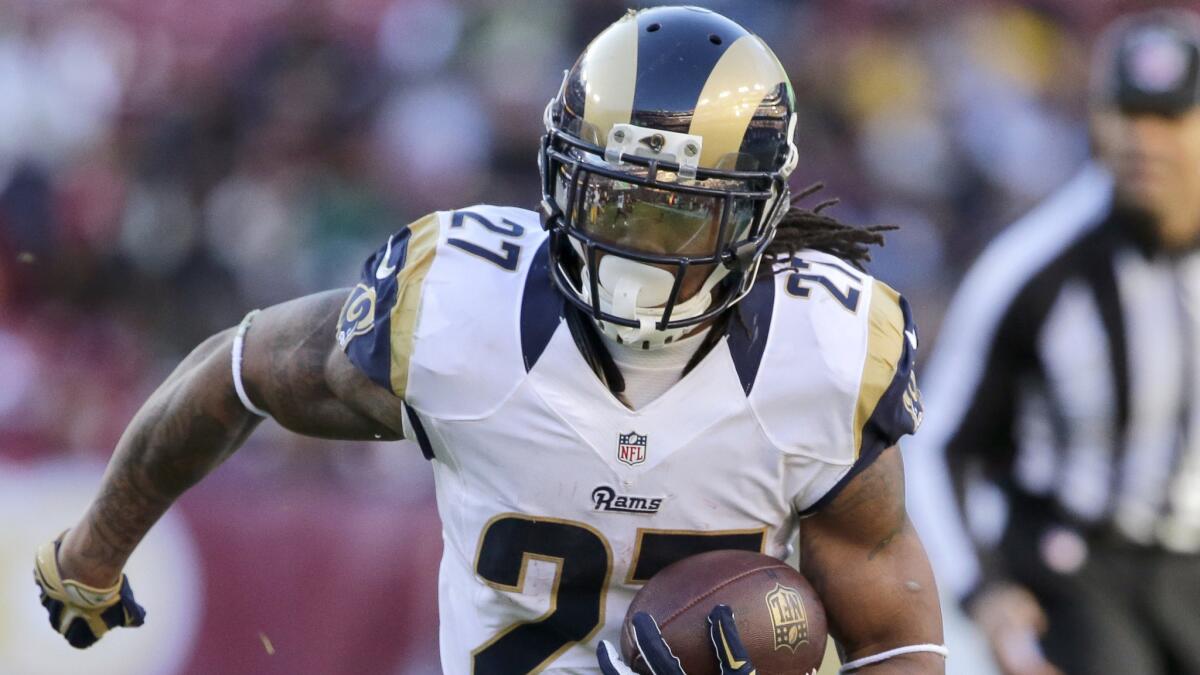 St. Louis Rams running back Tre Mason carries the ball during a 24-0 win over the Washington Redskins on Sunday.
