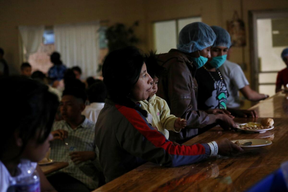 Migrants are fed lunch at the Casa del Migrante shelter in Ciudad Juarez. (Gary Coronado / Los Angeles Times)