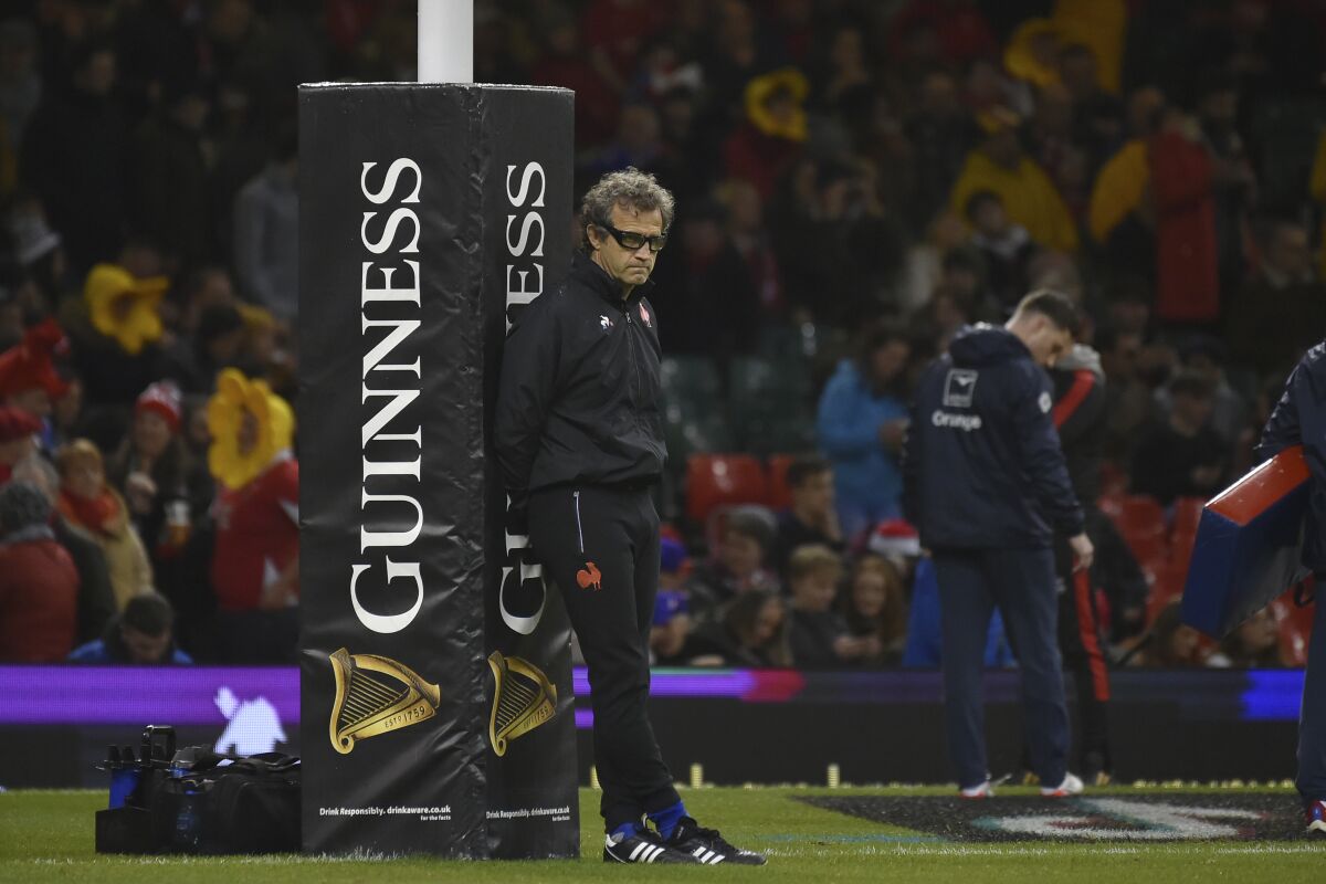 France's head coach Fabien Galthie leans on an advertising post before the start of the Six Nations rugby union international match between Wales and France at the Principality Stadium in Cardiff, Friday, March 11, 2022. (AP Photo/Rui Vieira)
