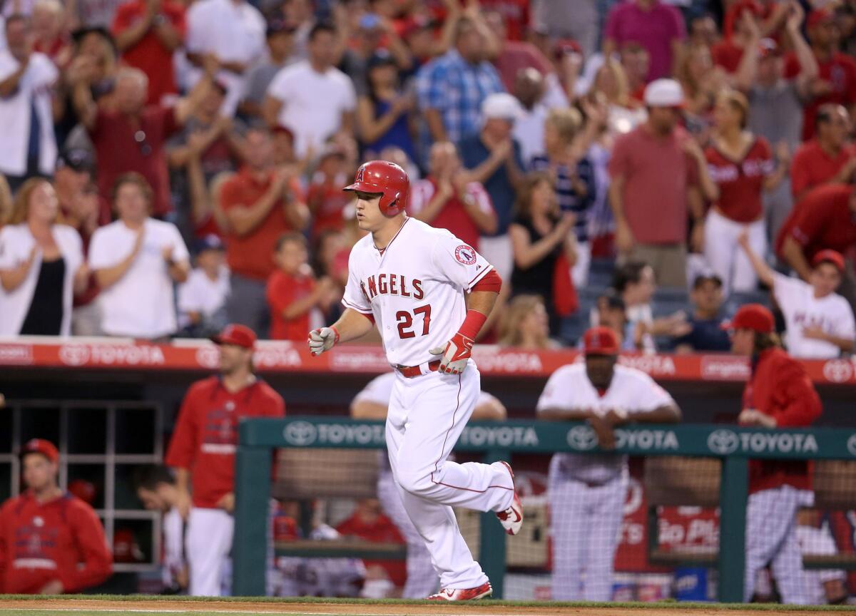 Mike Trout rounds the bases after hitting a solo home run against New York in the third inning of the Angels' 4-1 victory over the Yankees on Monday at Angel Stadium.