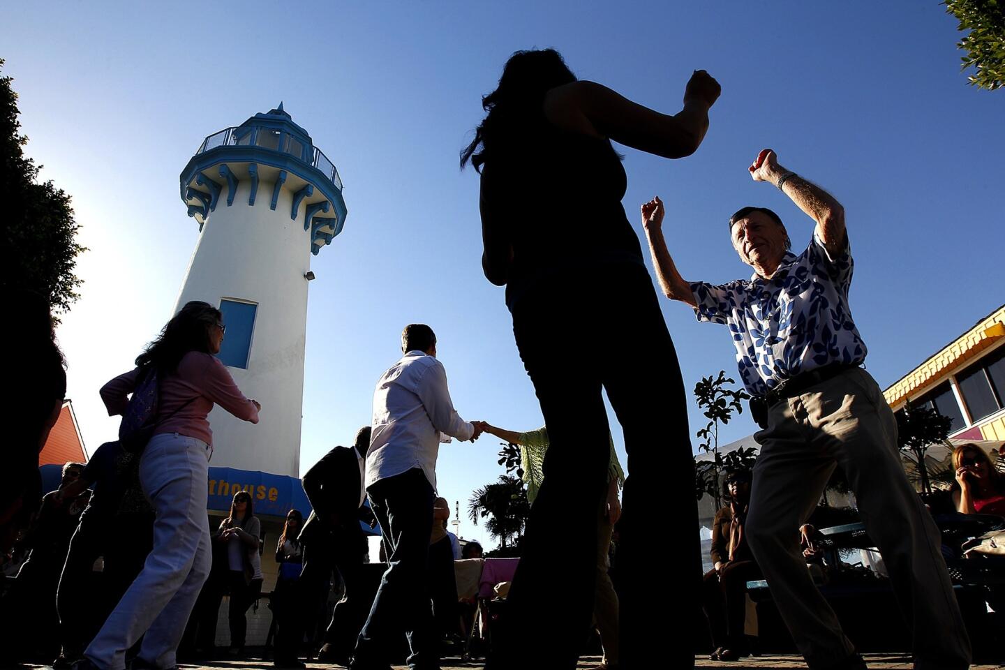 Visitors dance to live music at Fisherman's Village in Marina del Rey. Los Angeles County planners have been working on a new vision plan that will help guide the marina's development over the next several decades.