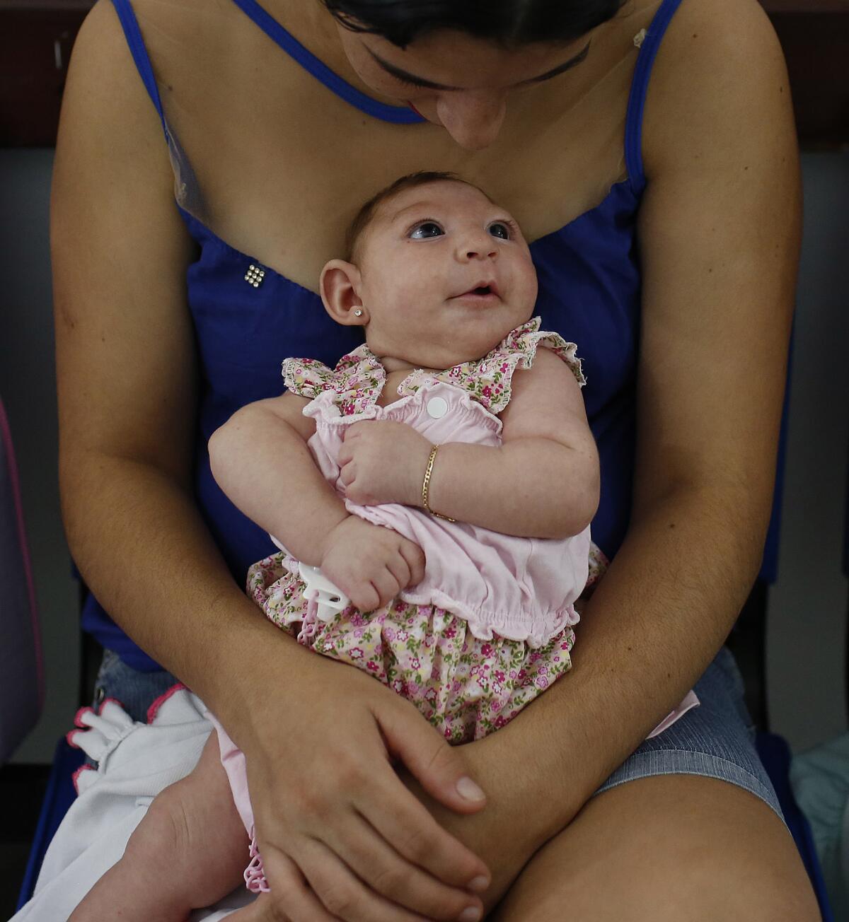 Maria Silva Flor, 20, holds her 2-month-old baby, Maria Alves, who was born with microcephaly. Mothers of children with microcephaly bring their babies twice a week to physiotherapy at Pedro I Municipal Hospital in Campina Grande, Brazil.