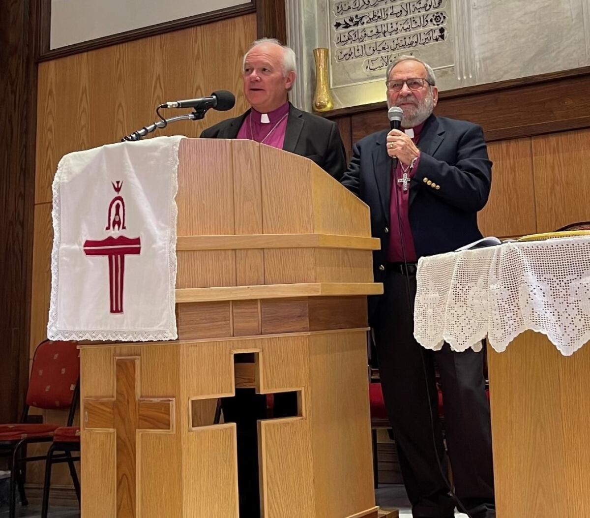 The Rev. Jack Baca preaching at a Presbyterian church in Damascus in October; interpreter on the right.