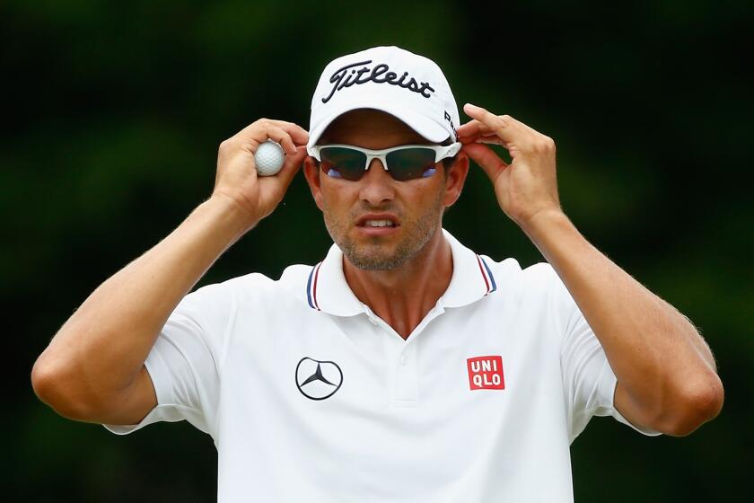 Adam Scott waits on a green during the final round of the Players Championship in Ponte Vedra Beach, Fla.