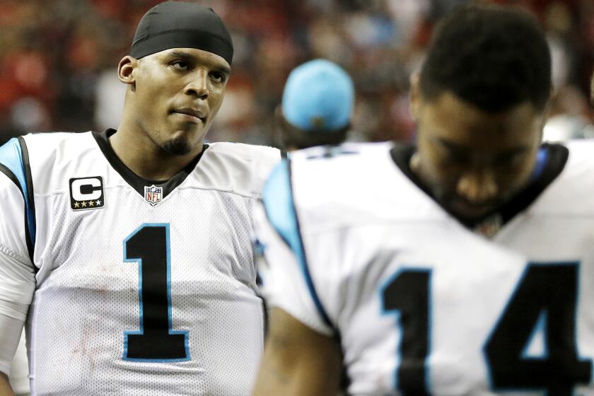 Quarterback Cam Newton (1) leaves the field after the Panthers lost their first game of the season, 17-13 to the Falcons, on Sunday.