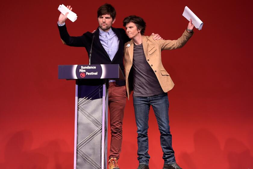 Adam Scott, left, and Tig Notaro speak onstage during the Sundance Film Festival Awards Ceremony.