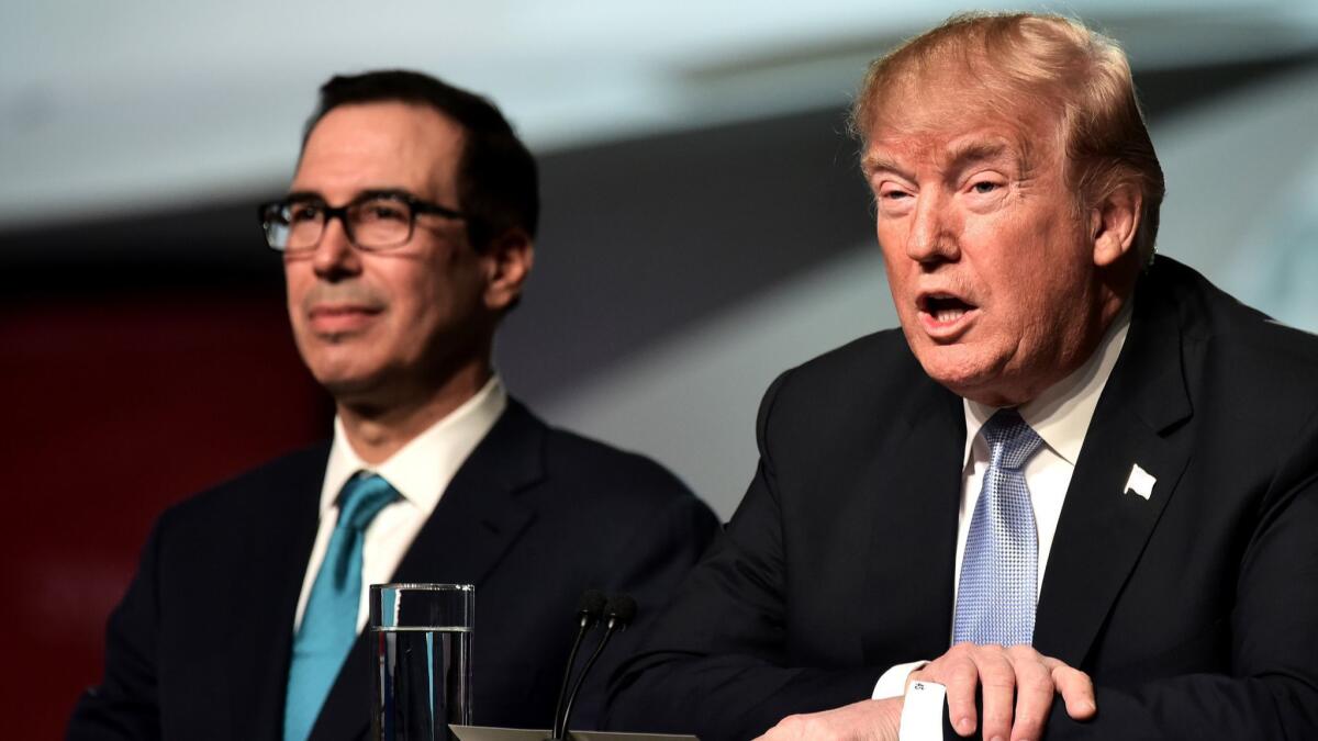 Treasury Secretary Steven Mnuchin with President Trump in St. Louis in March 2018.