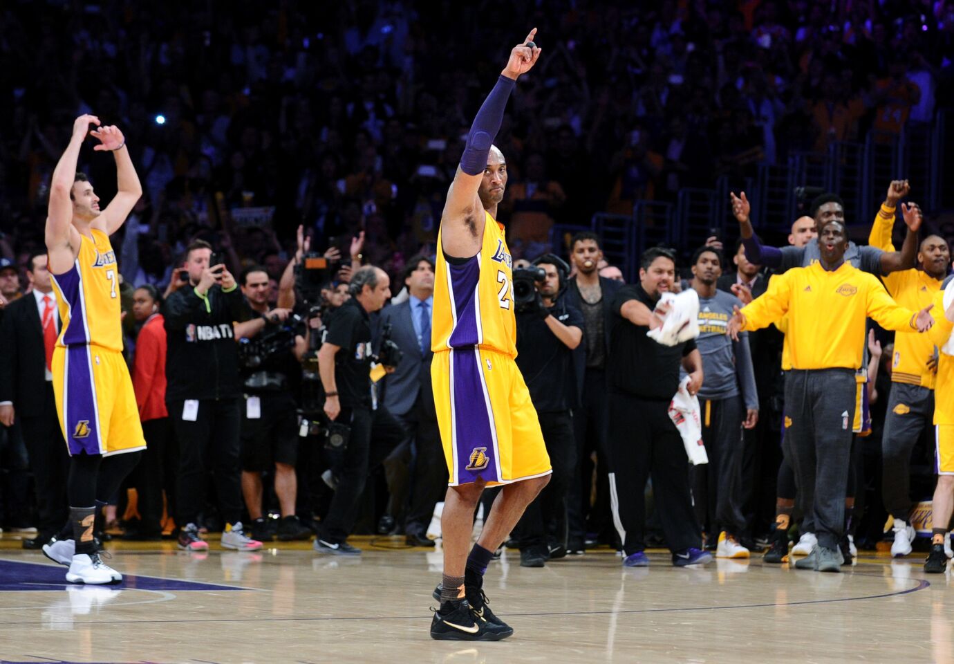 Kobe Bryant waves goodbye to the crowd after his final game at the Staples Center.