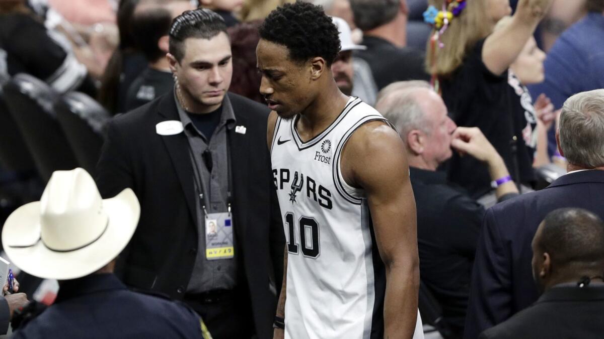 Spurs guard DeMar DeRozan leaves the court after he was ejected from Game 4 against the Nuggets on Saturday.
