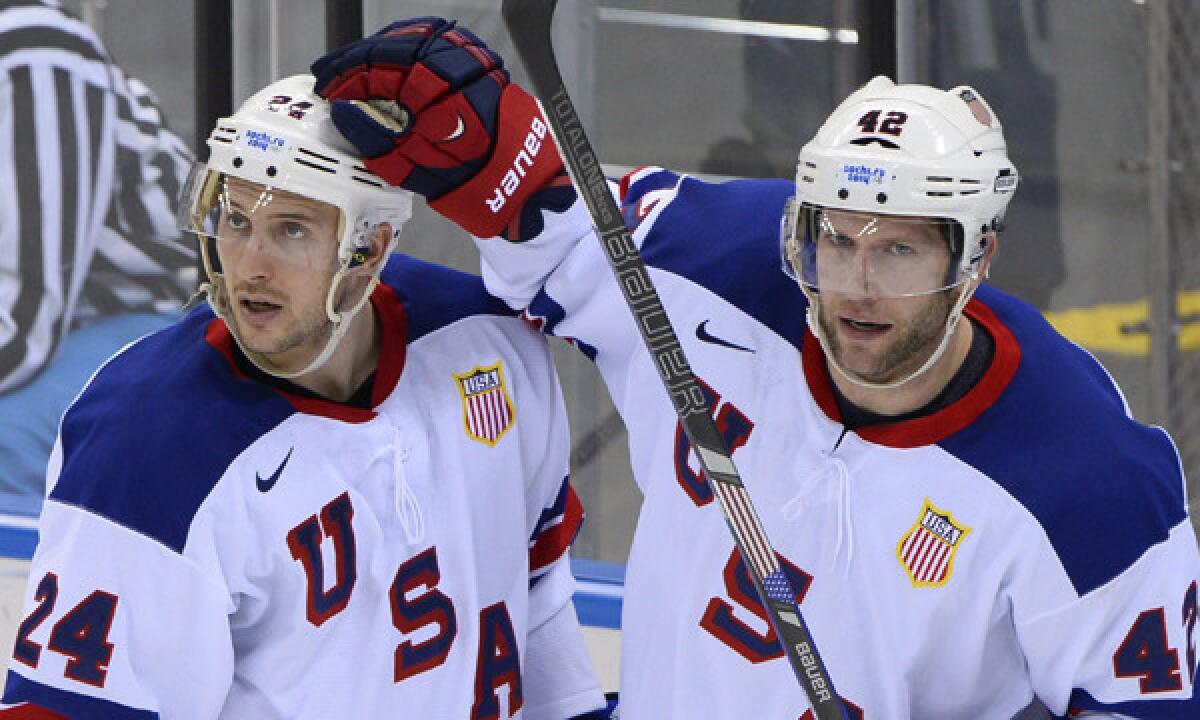 Team USA's David Backes, right, celebrates with teammate Ryan Callahan after scoring during Sunday's win over Slovenia. The United States faces a much tougher test in the quarterfinals Wednesday against Czech Republic.
