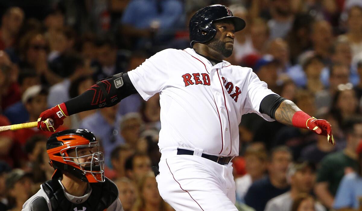 Boston Red Sox's David Ortiz follows through on a two-run home run against the Baltimore Orioles during the sixth inning last season.