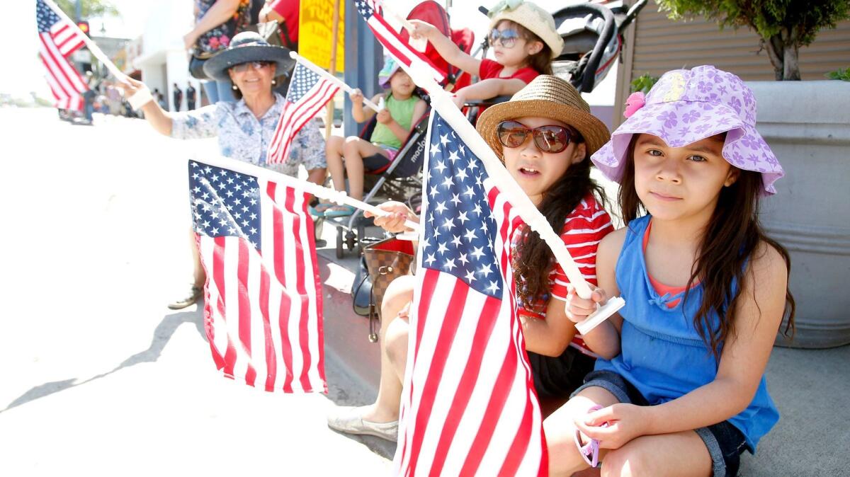 People watch the Canoga Park Memorial Day Parade in 2013.