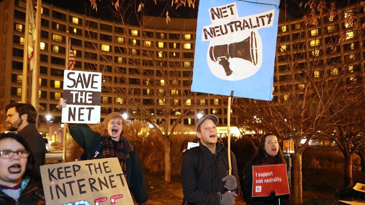 About 60 demonstrators show their support for net neutrality outside a dinner attended by Ajit Pai, chairman of the Federal Communications Commission, in Washington, D.C.