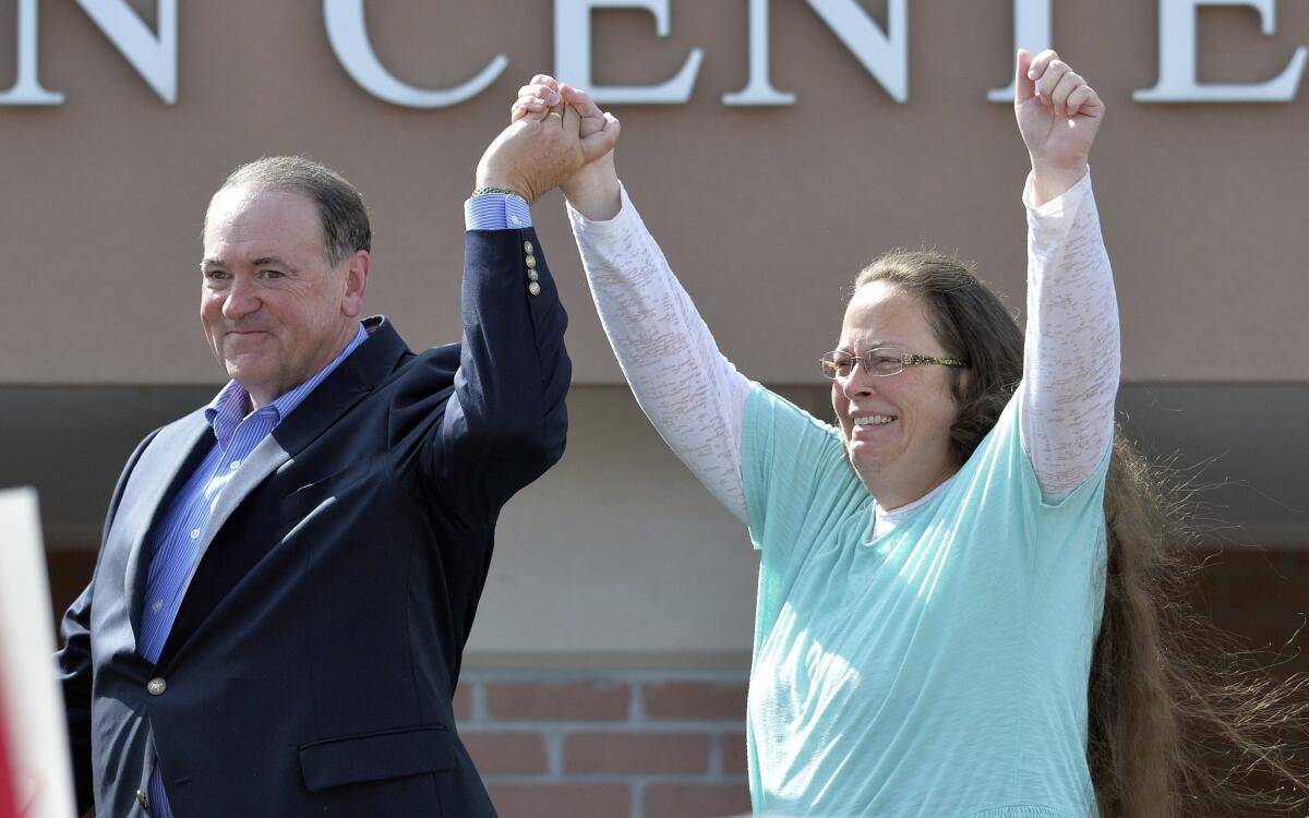 Rowan County Clerk Kim Davis stands with Republican presidential candidate Mike Huckabee after being released from the Carter County Detention Center in Grayson, Ky., on Sept. 8.