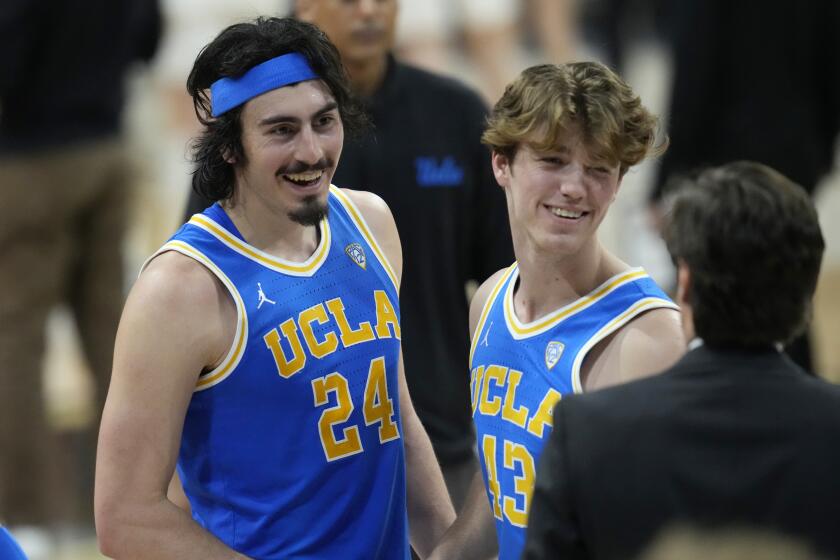 UCLA guard Jaime Jaquez Jr., left, celebrates with guard Russell Stong after the second half.