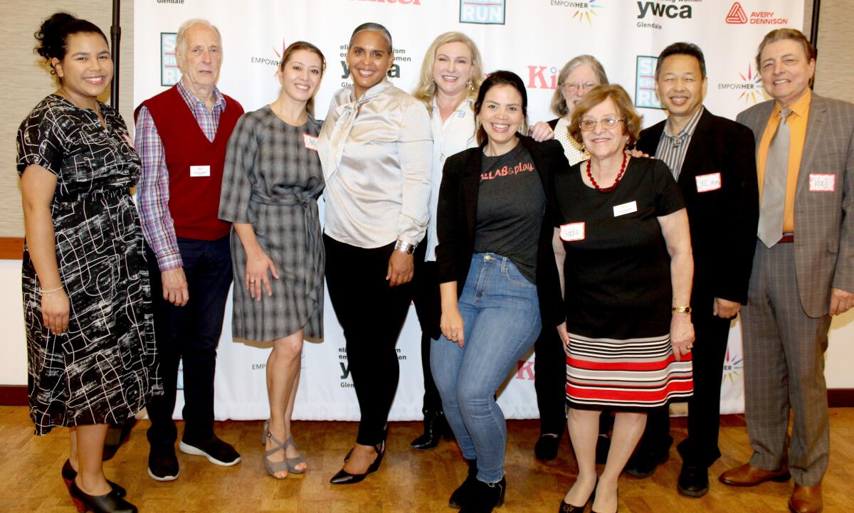 At the 2019 EmpowHER Brunch, the Glendale YWCA board gathers for a photo op. Tara Peterson, executive director of the YWCA, is fourth from the left. Glendale City Councilman Vrej Agajanian is on the far right.