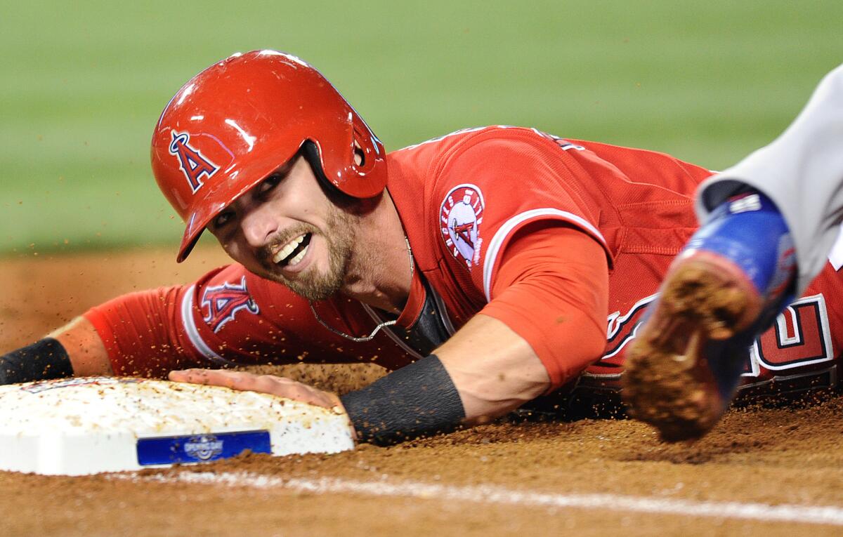 Angels second baseman Johnny Giavotella is picked off at first base against the Cubs in the third inning.