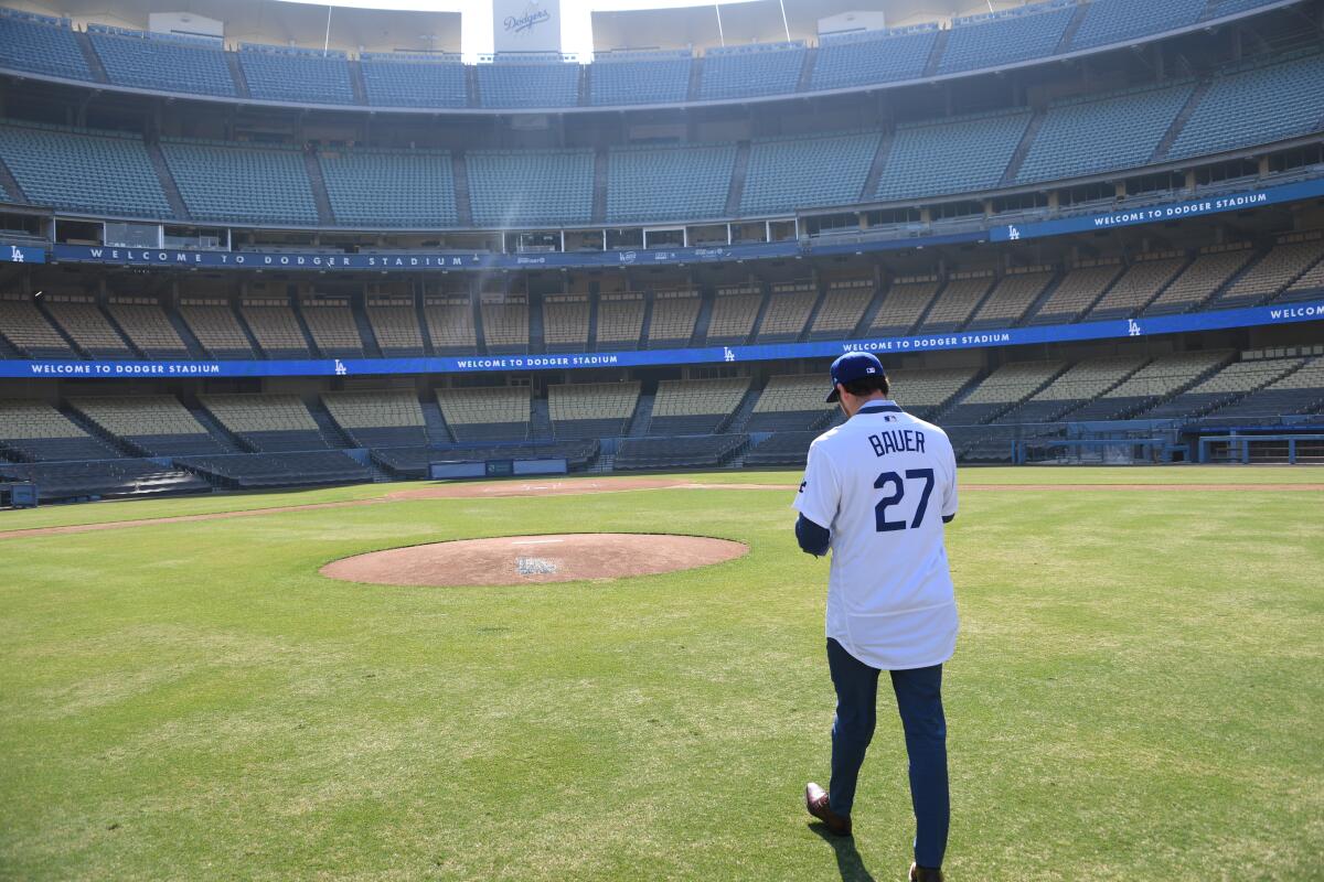 Trevor Bauer walks to the pitcher's mound during a news conference at Dodger Stadium on Thursday.
