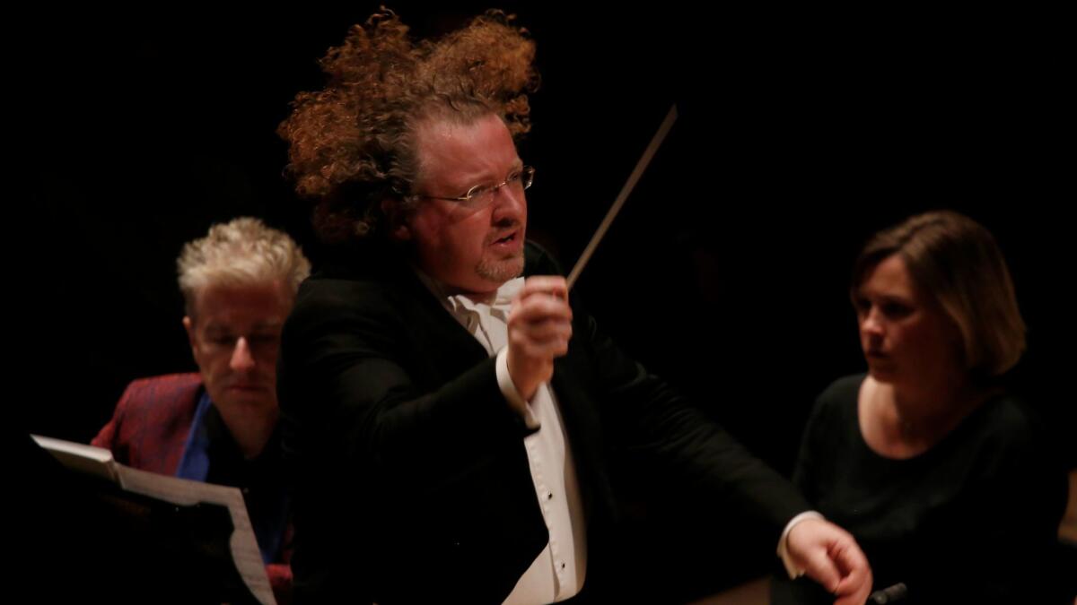 Stéphane Denève conducts the Los Angeles Philharmonic in the West Coast premiere of James MacMillan's Third Piano Concerto with Jean-Yves Thibaudet as soloist at Disney Hall. (Francine Orr / Los Angeles Times)