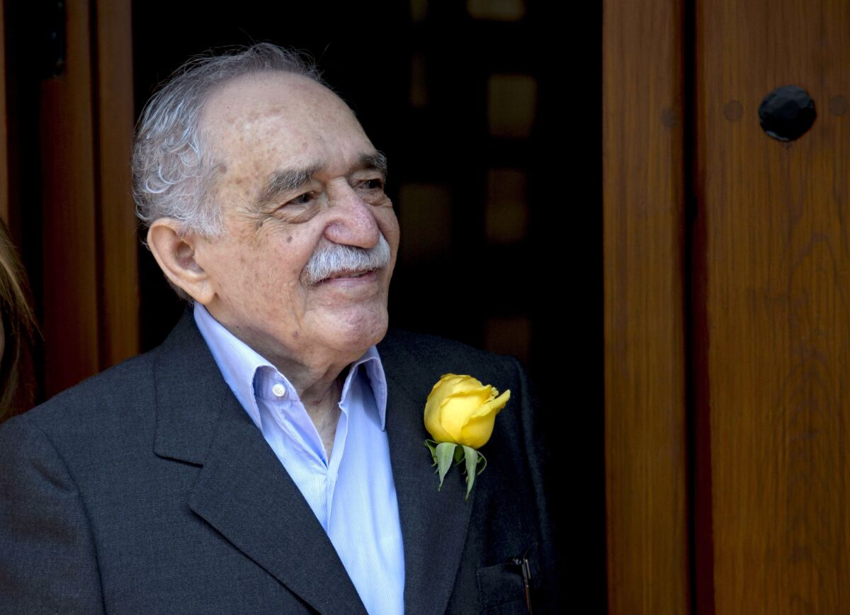 FILE - Colombian Nobel Literature laureate Gabriel Garcia Marquez greets fans and reporters outside his home on his 87th birthday in Mexico City, March 6, 2014. It was reported Sunday Jan. 16, 2022 that the late Garcia Marquez had a daughter out of wedlock in Mexico. (AP Photo/Eduardo Verdugo, File)